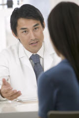 Doctor Explaining something to a Patient Photo